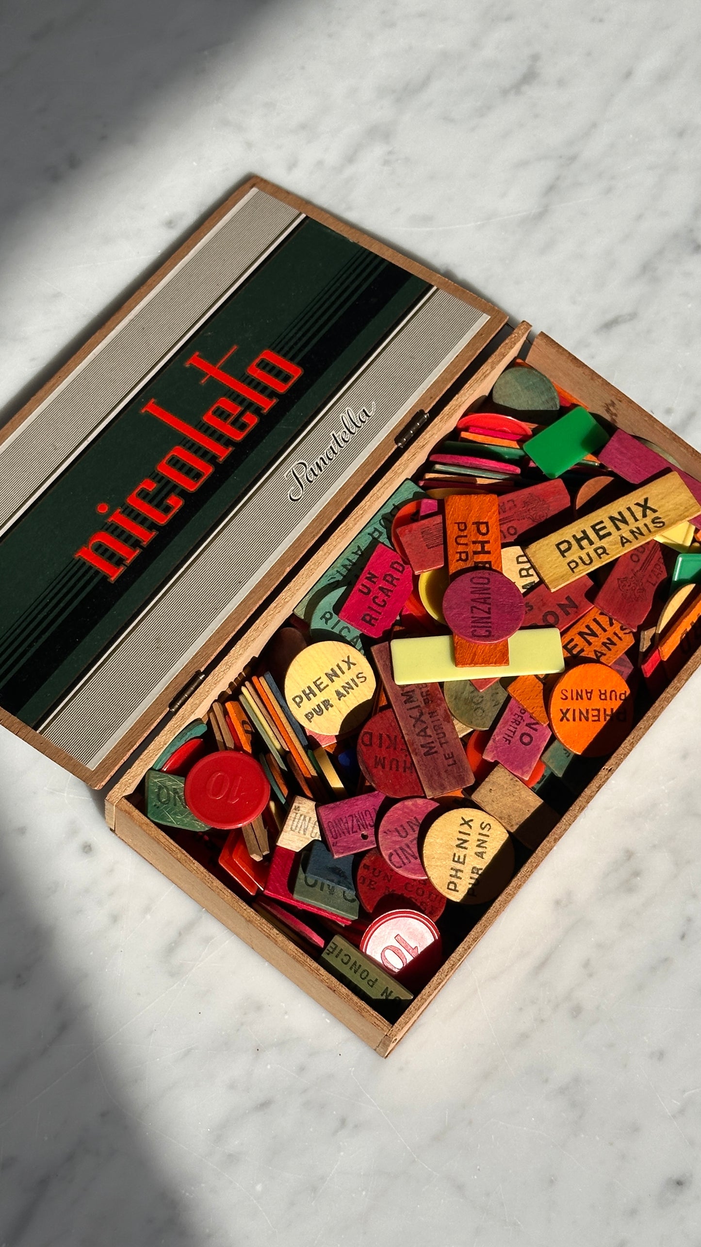 Collection of Advertising / Bar Tokens in Vintage Nicoleto Cigar Box