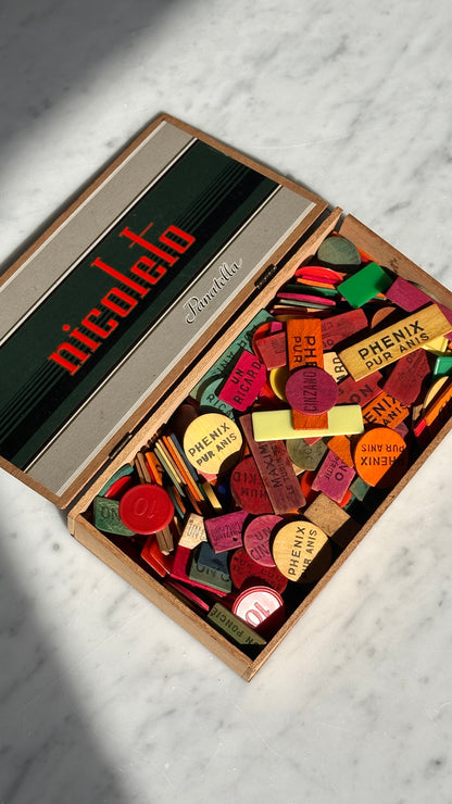Collection of Advertising / Bar Tokens in Vintage Nicoleto Cigar Box