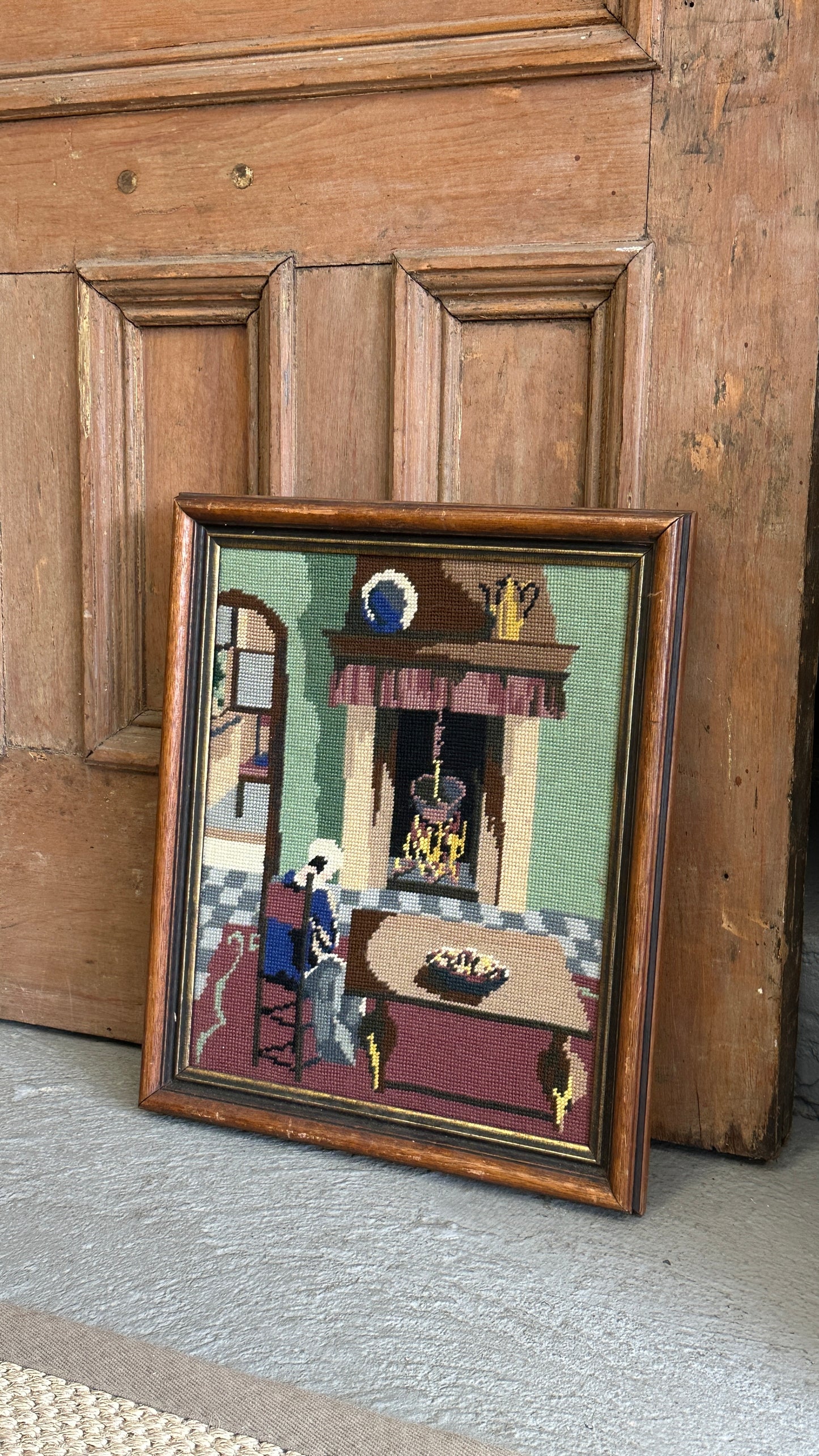 Framed Needlepoint of Woman and Fireplace