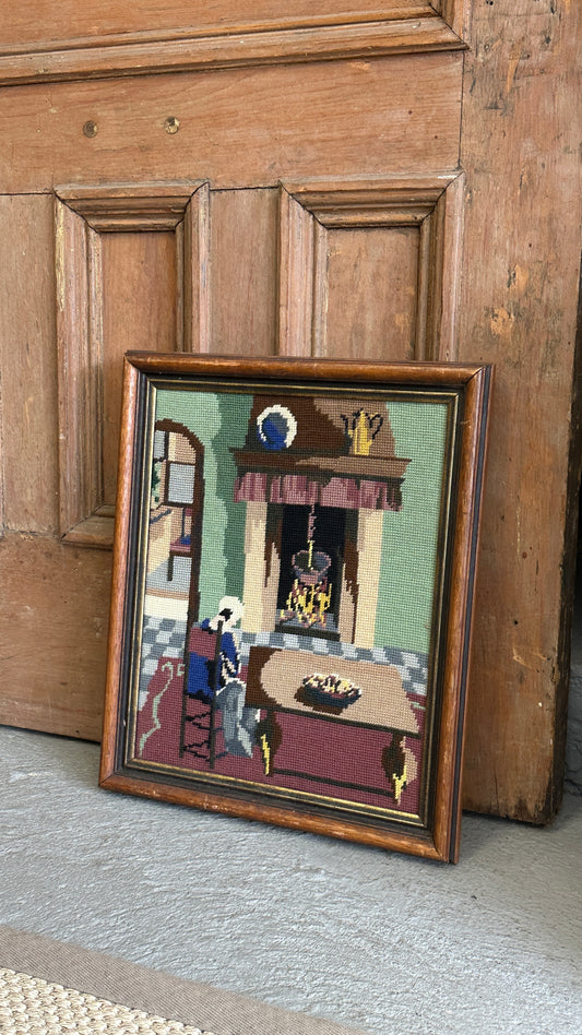 Framed Needlepoint of Woman and Fireplace