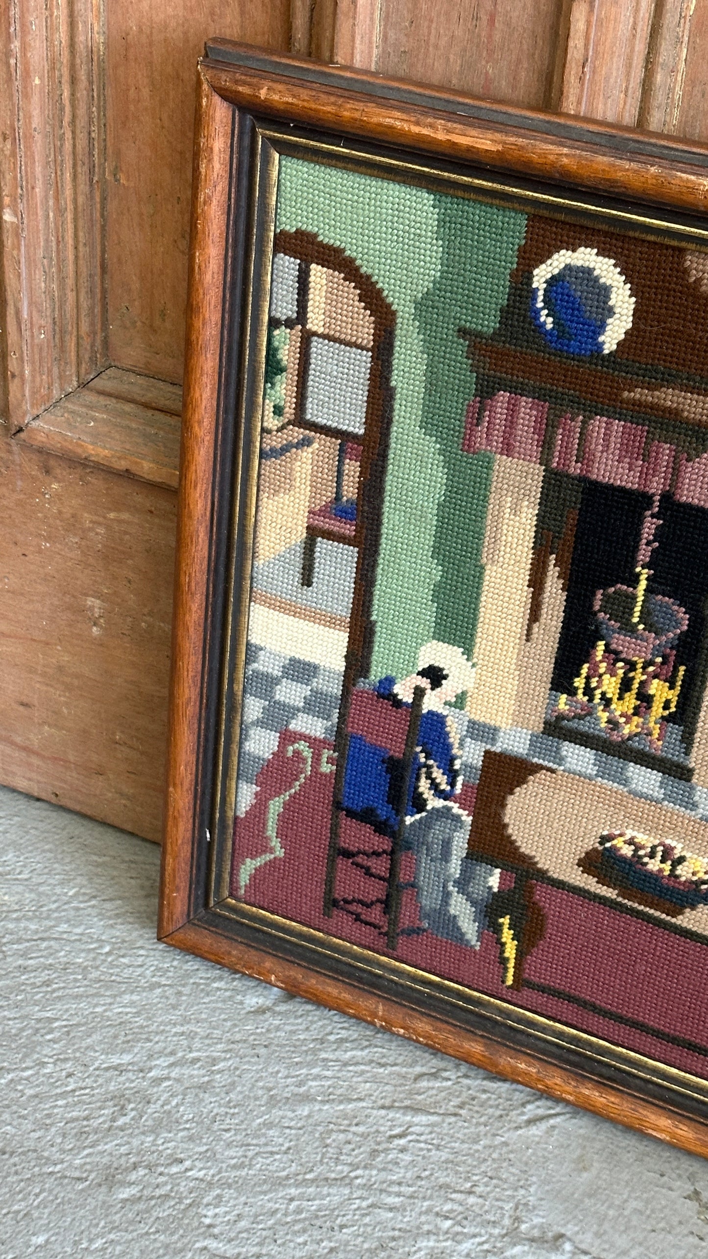 Framed Needlepoint of Woman and Fireplace