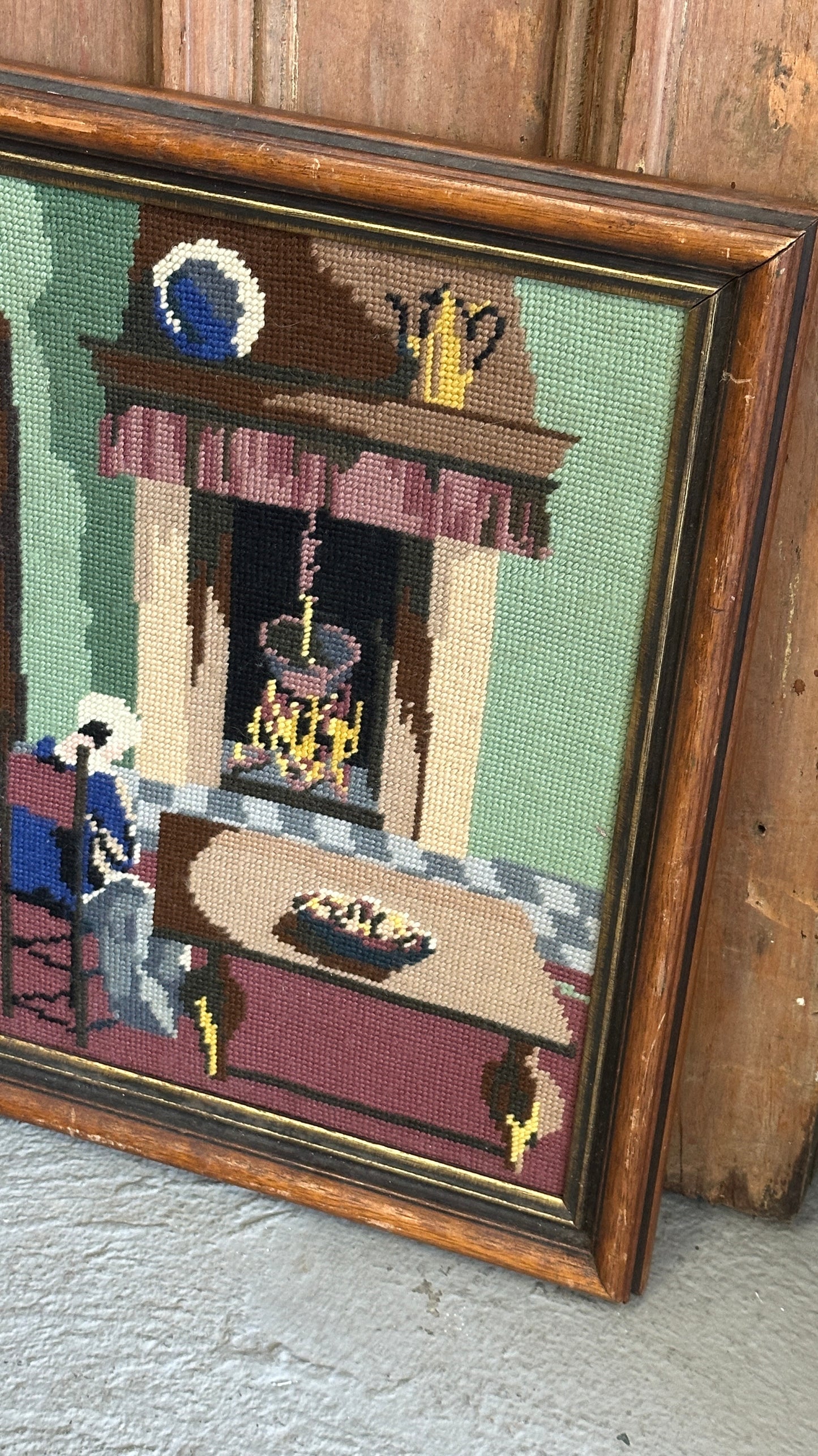 Framed Needlepoint of Woman and Fireplace