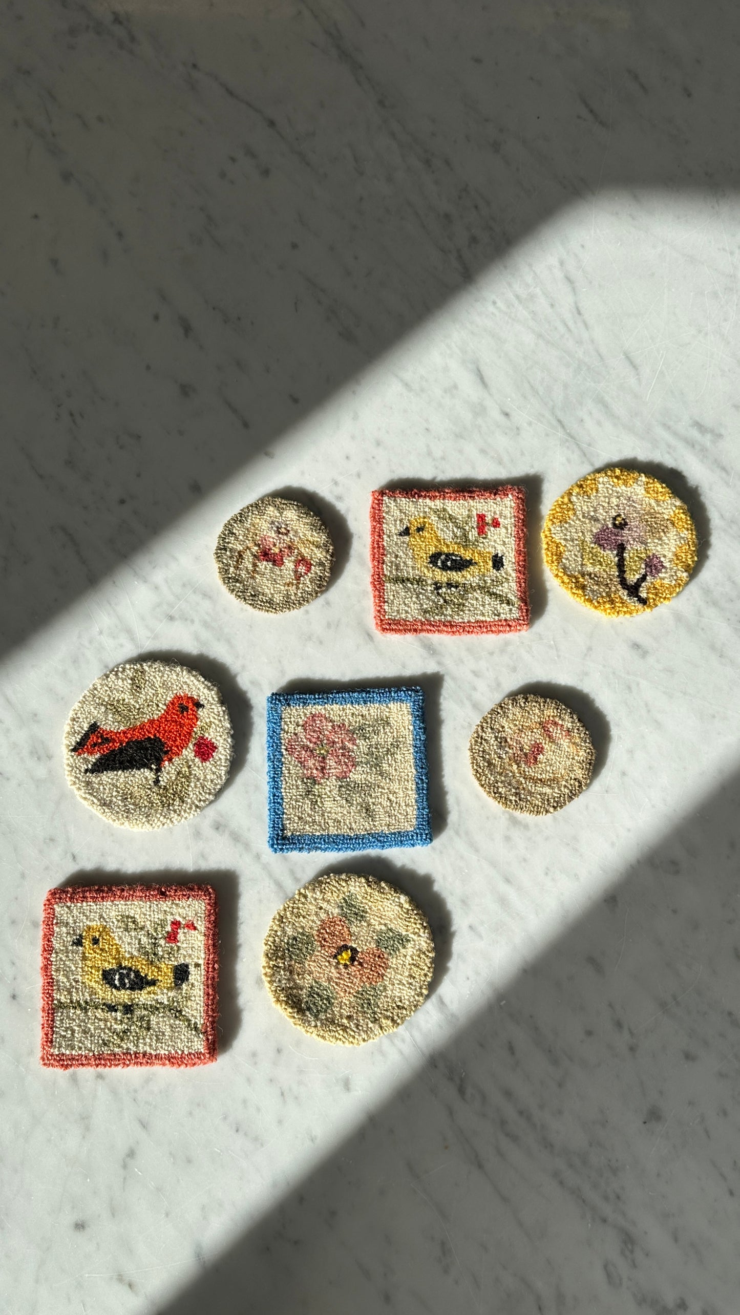 Collection of 8 Chéticamp Hooked Coasters