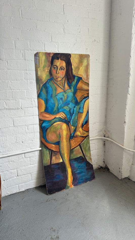 Seated Woman Painting on Board