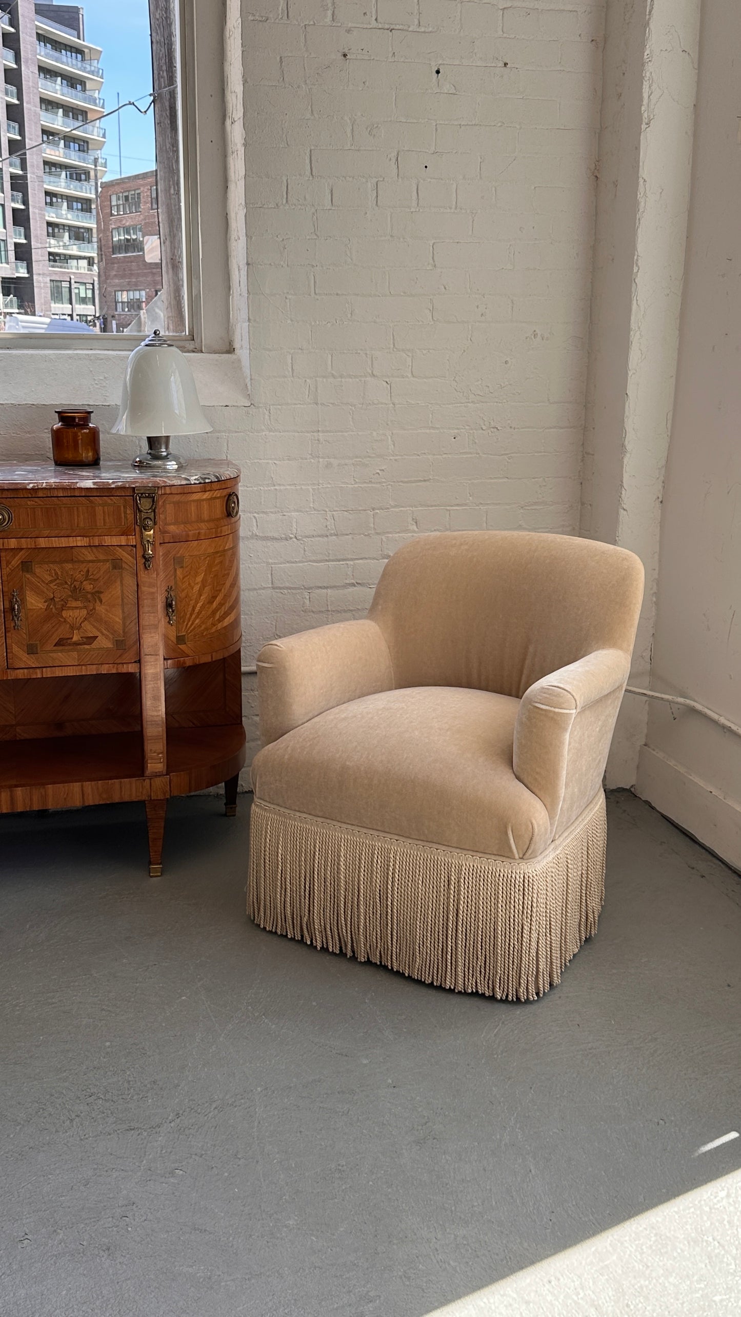 Upholstered Roll Arm Club Chair with Tassel Skirt